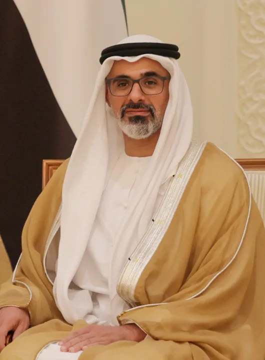 Sheikh Khaled bin Mohamed bin Zayed Al Nahyan seated in a gold-trimmed bisht during an official meeting in Abu Dhabi