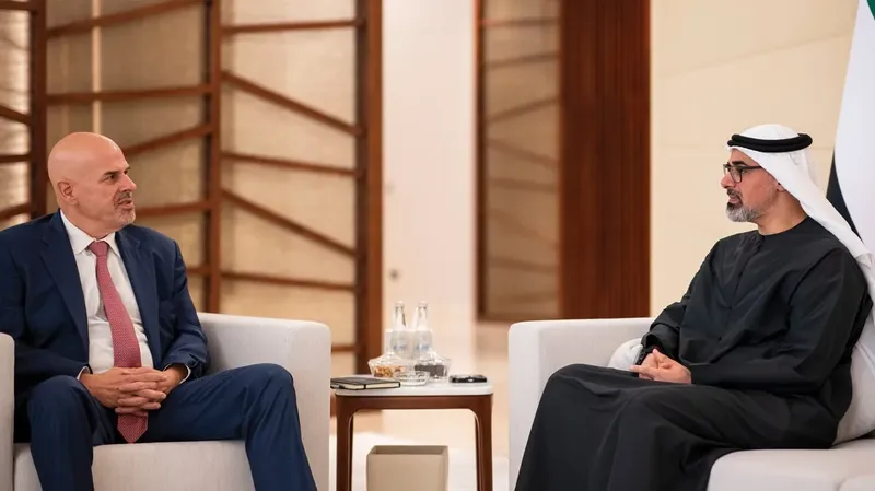 Sheikh Khaled bin Mohamed bin Zayed Al Nahyan seated in a formal reception room during a meeting with a visiting guest